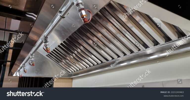 stock photo stainless steel shiny exhaust hood with grease baffles and fire suppression system 2221243463